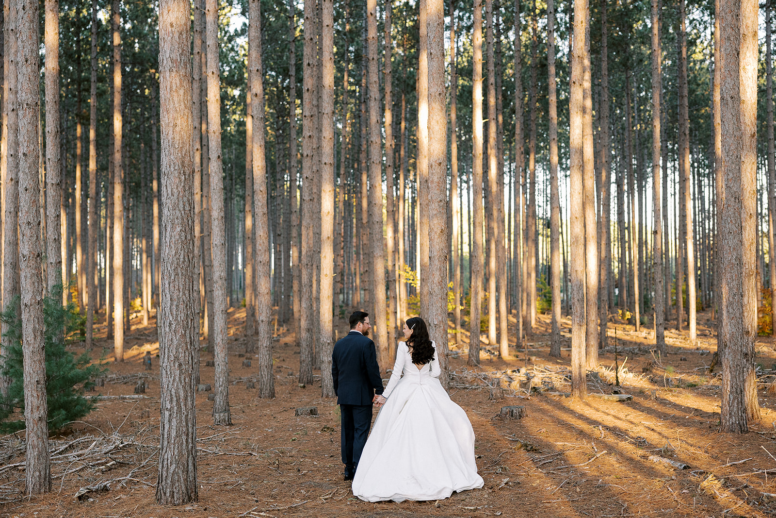 Beautiful outdoor wedding photo of bride and groom in fall