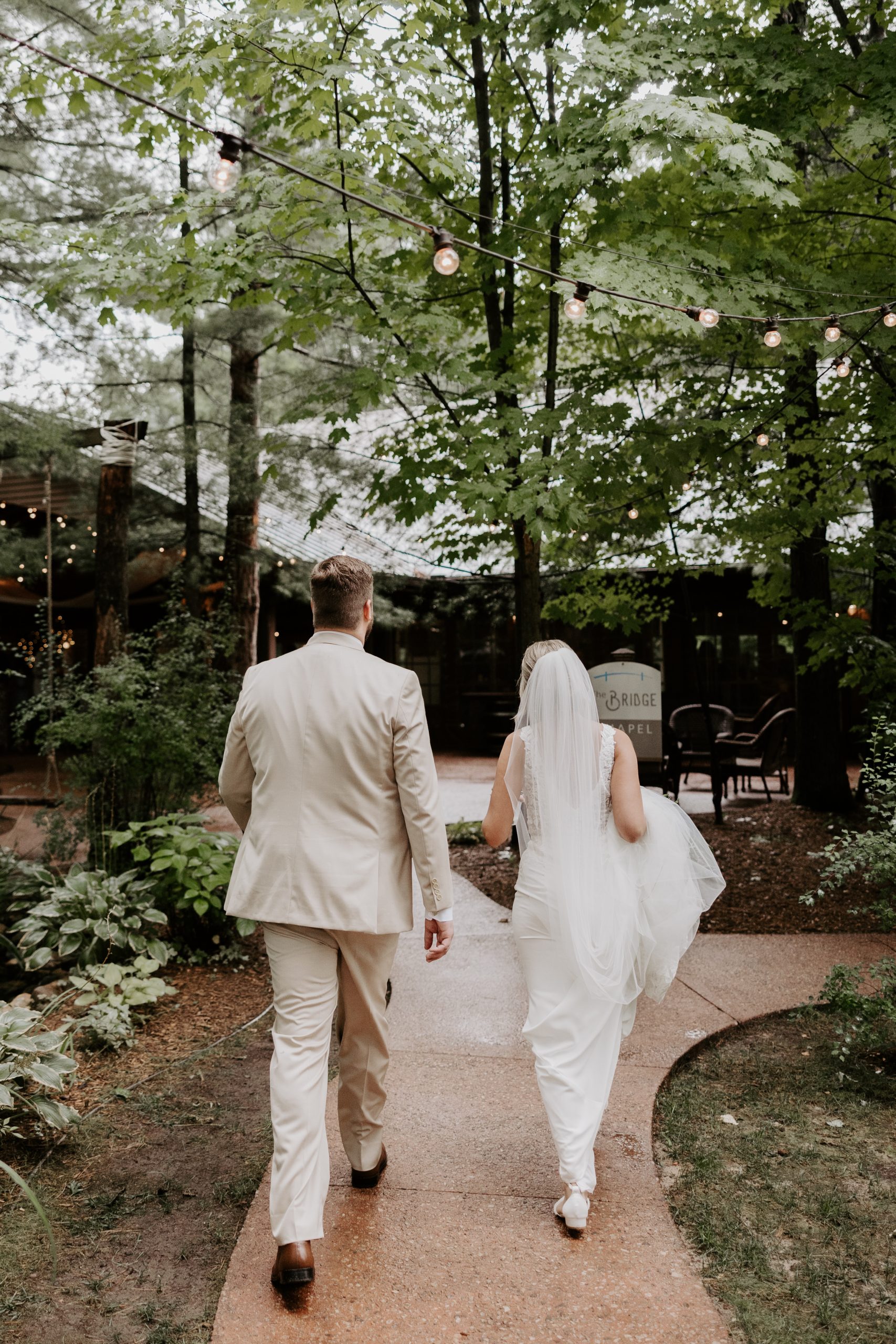 Bride and Groom walking in wedding venue