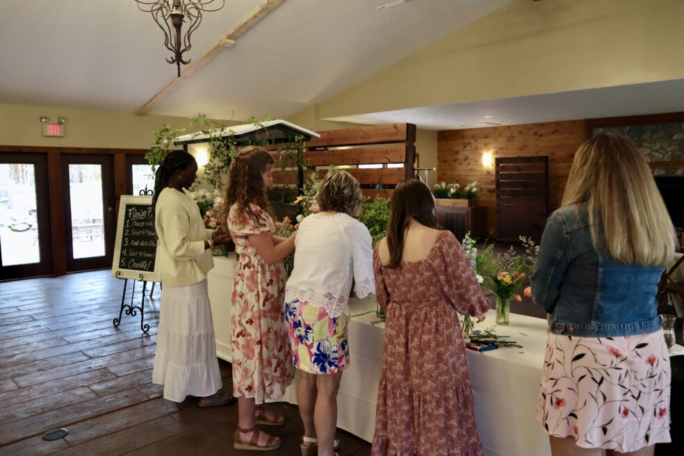 Ladies enjoying a bloom bar setup